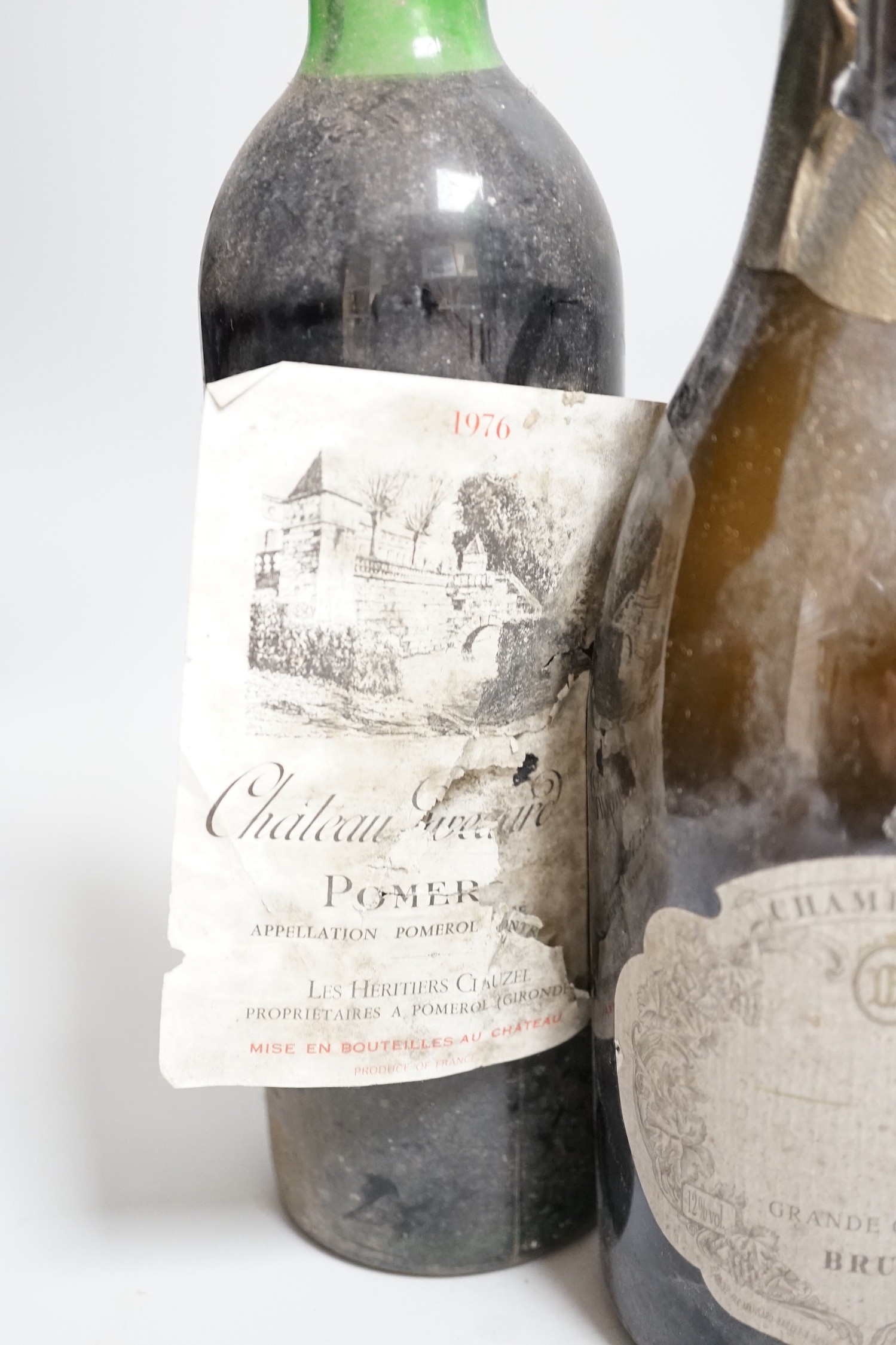 Three bottles of Chateauneuf-du-pape, One bottle of Pomerol, one bottle of port and one bottle of champagne